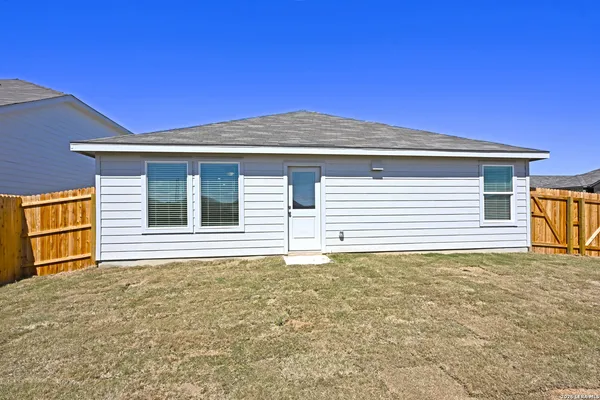 a view of house with yard