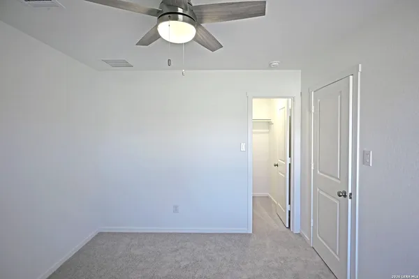 a kitchen with cabinets stainless steel appliances and a window