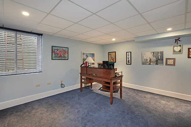 616 Ridge Road Winnetka, IL 60093 - Photo 8 of 23 a bedroom with furniture and a window