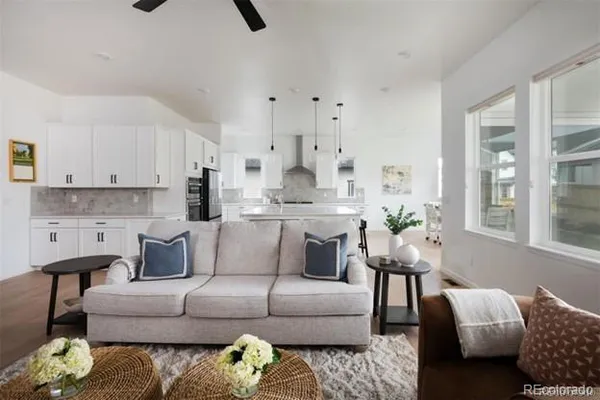 a living room with furniture and a large window