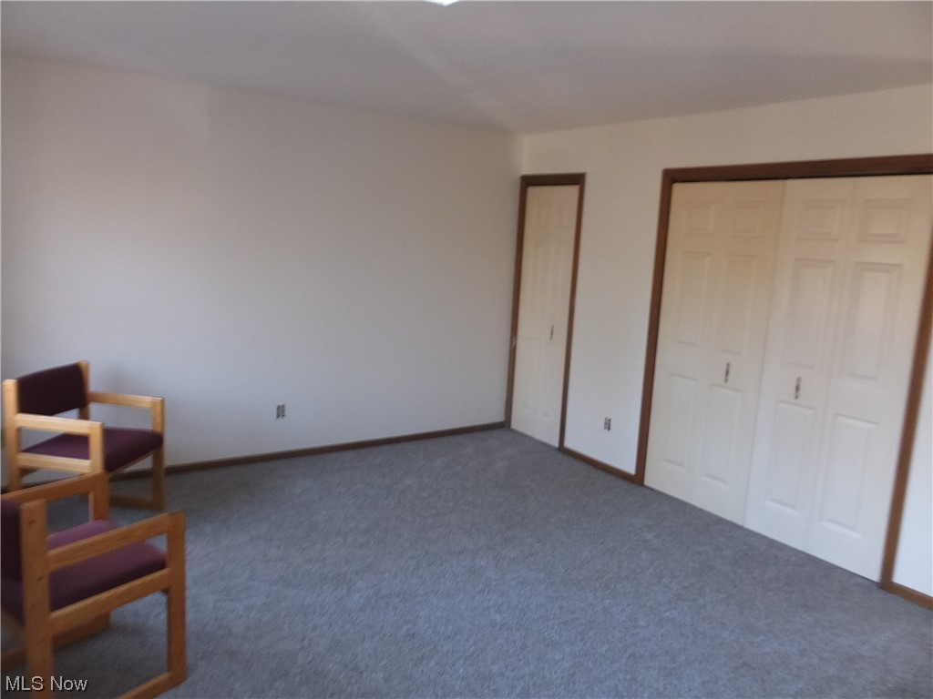 4058 Webb Road Ravenna, OH 44266 - Photo 20 of 24 Unfurnished bedroom with dark colored carpet and a closet