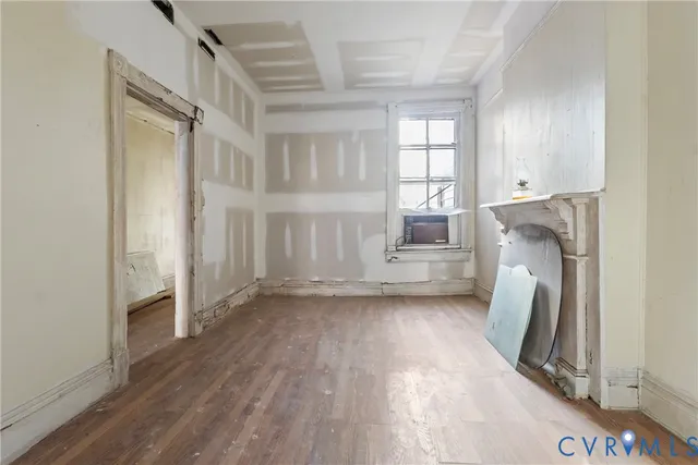 a view of a room that has a fireplace in it