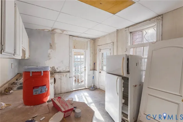 a refrigerator freezer sitting inside of a kitchen