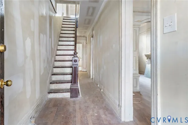 a view of a hallway with stairs