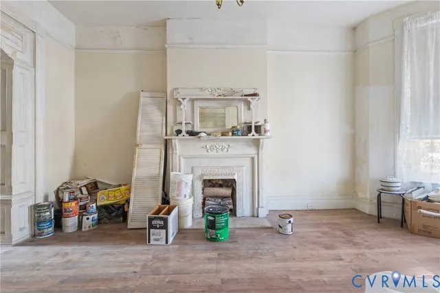 a view of a livingroom with furniture and a fireplace