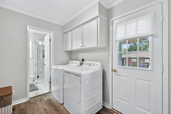 a utility room with closet dryer and washer
