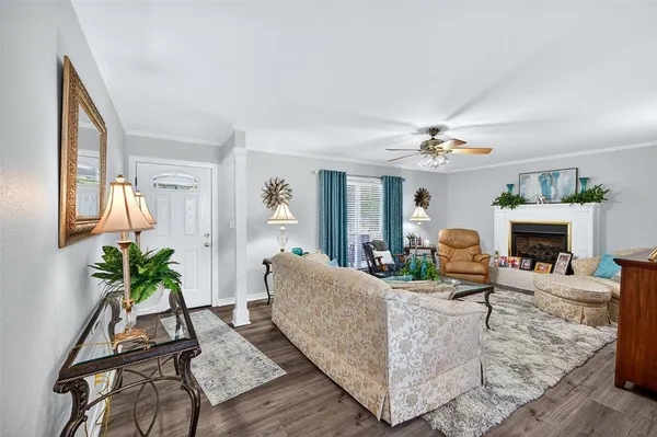 a living room with furniture and a fireplace