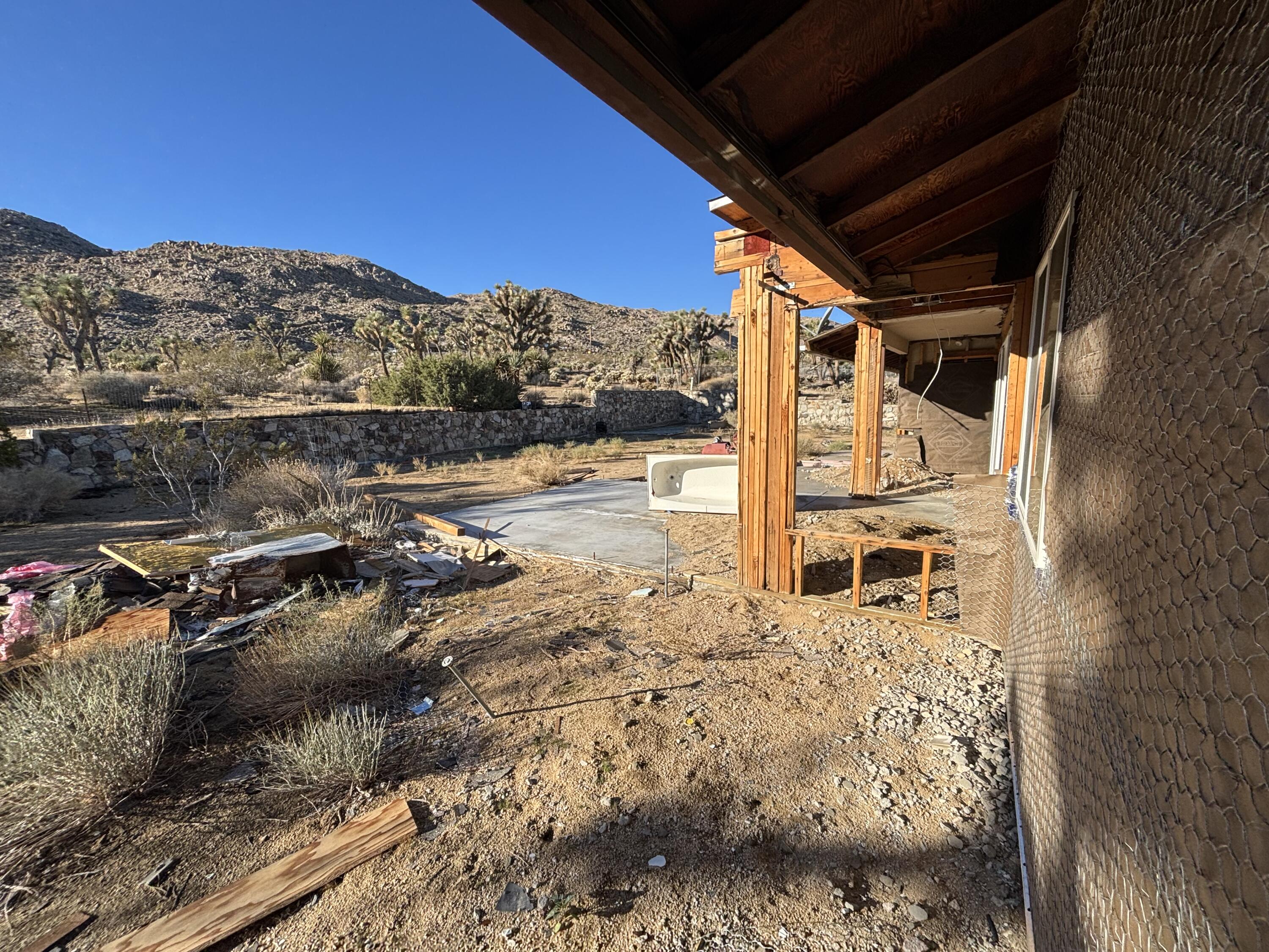 60959 Prescott Trail Joshua Tree, CA 92252 - Photo 24 of 30 a view of a backyard of a house