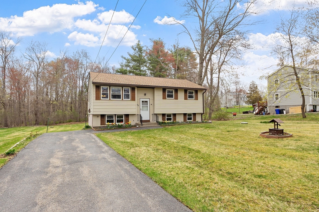 69 Little Turnpike Road Shirley, MA 01464 - Photo 1 of 37 a view of a house with backyard and sitting area