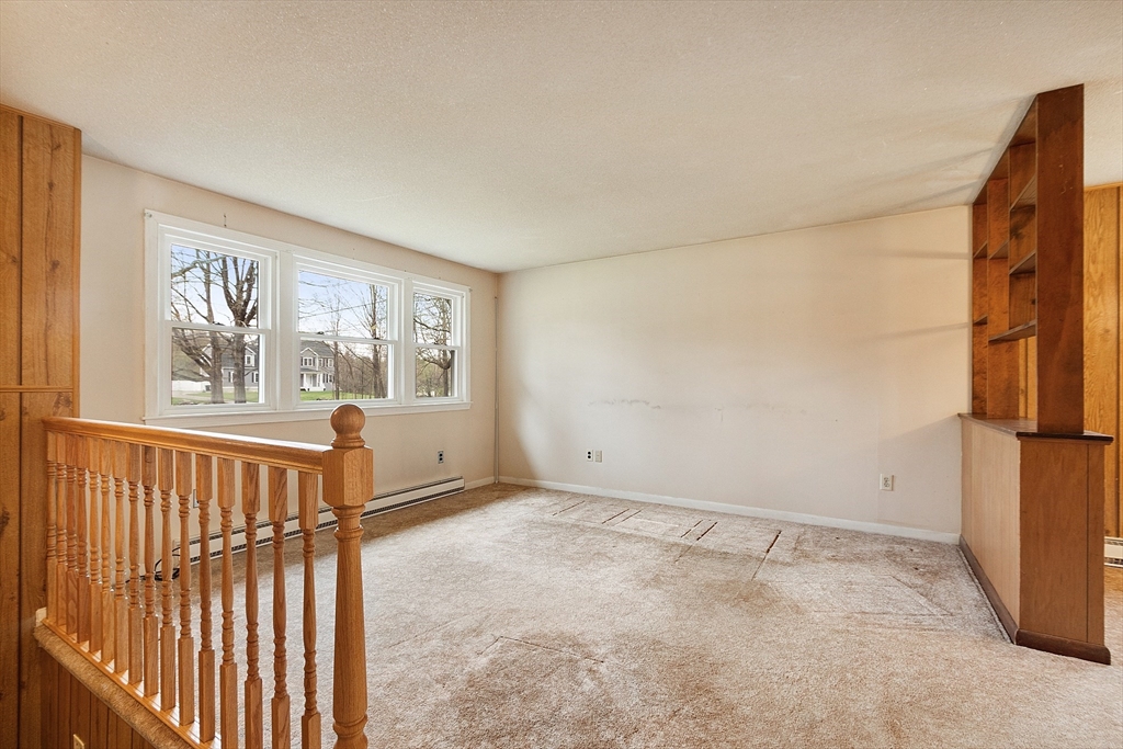 69 Little Turnpike Road Shirley, MA 01464 - Photo 17 of 37 a view of an empty room with a window