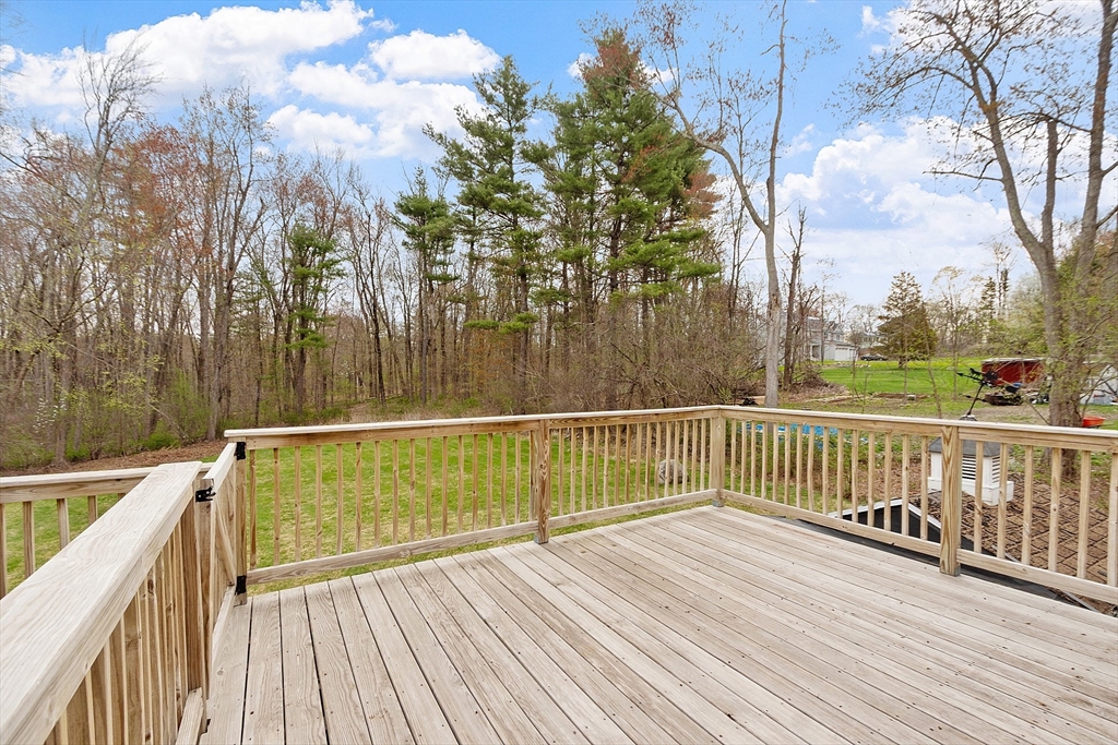 69 Little Turnpike Road Shirley, MA 01464 - Photo 5 of 37 a view of balcony with wooden floor and fence