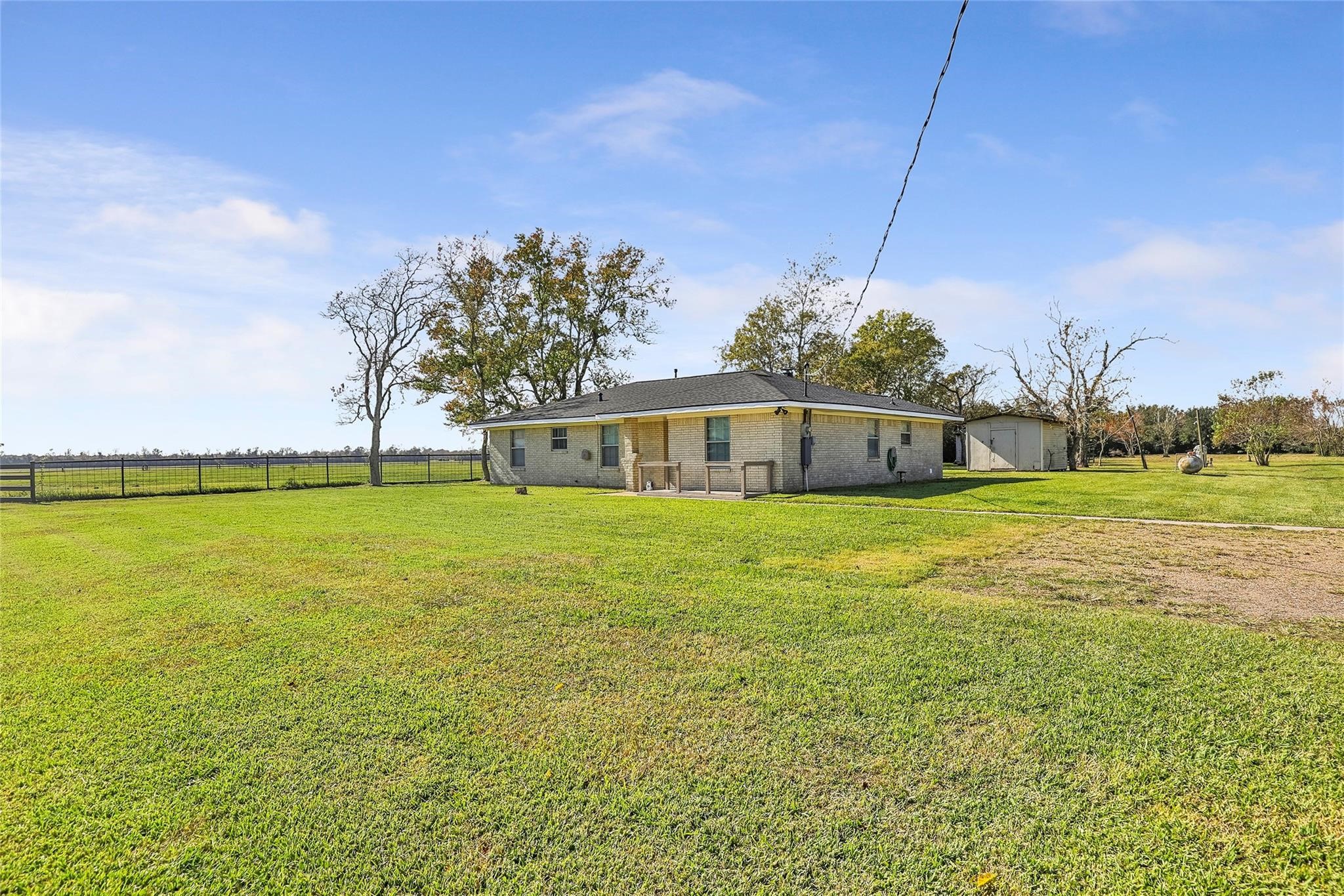 17219 Janacek Road Crosby, TX 77532 - Photo 2 of 14 Back view of homesite featuring the brick home