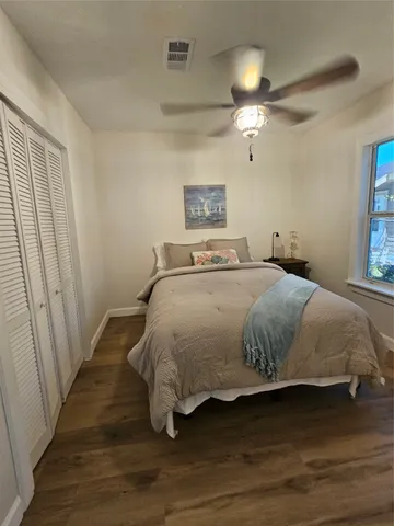 a bedroom with a bed and a cabinets