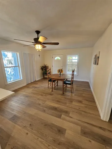 a bathroom with a granite countertop toilet and a sink