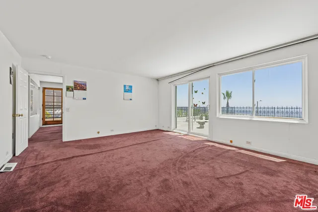 a bathroom with a granite countertop sink a toilet and mirror