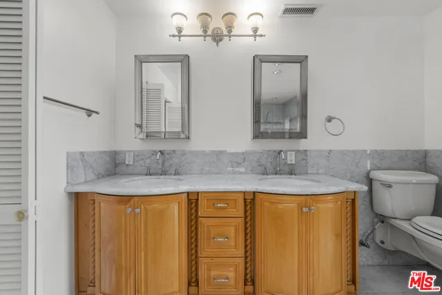 a white bath tub sitting in a bathroom next to a window