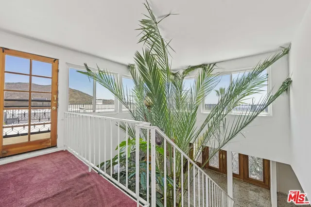 a bathroom with a granite countertop sink mirror and vanity