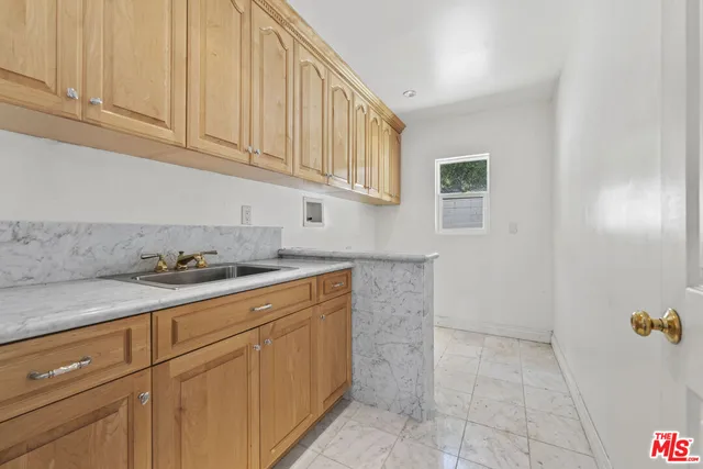 a view of a house with a wooden floor and a yard