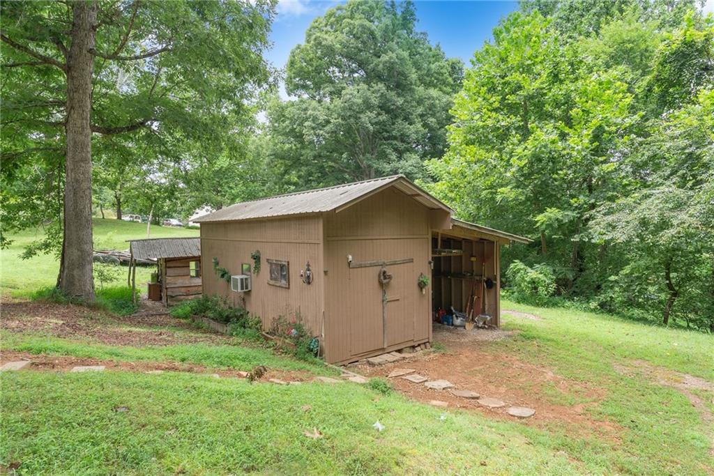 3615 South Bend Road Gainesville, GA 30506 - Photo 46 of 54 a view of a barn in the middle of a yard