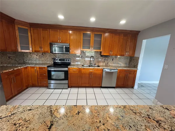 a view of a dining room with furniture and window