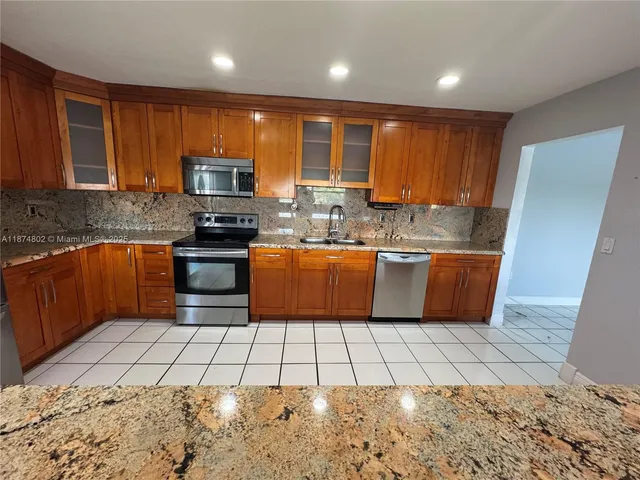 a view of a dining room with furniture and window