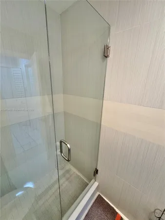 a bathroom with a double vanity sink and mirror