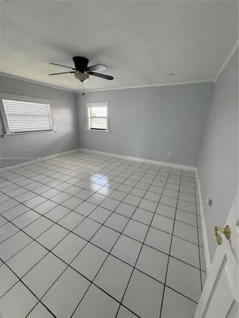 a bathroom with a sink a toilet a mirror and shower