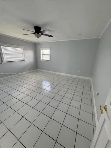 a bathroom with a sink a toilet a mirror and shower