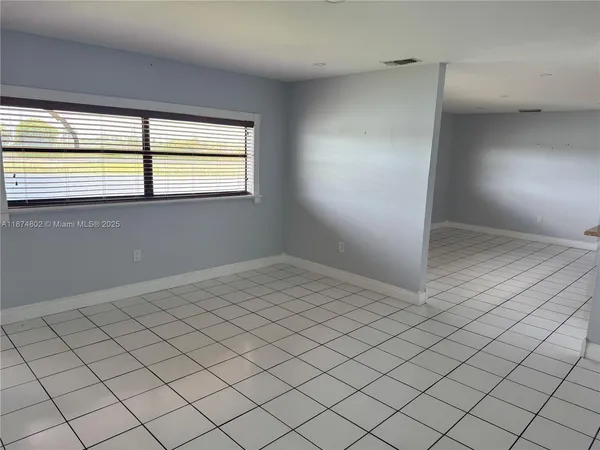 a view of an empty room and window