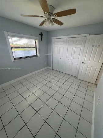 a view of a backyard with plants and patio