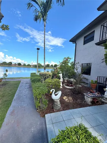 a view of a lake with houses in the back