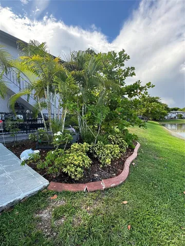 a view of a lake with a house in the background
