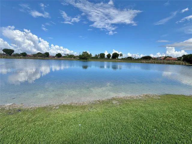 a view of a lake with houses in outdoor space