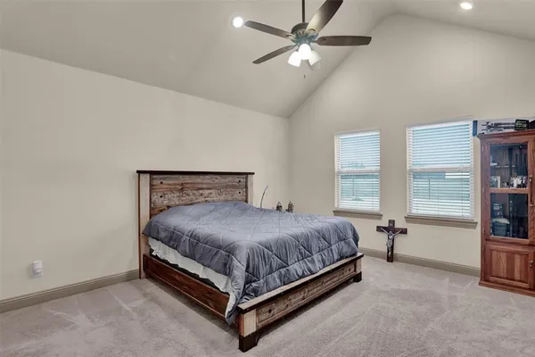 a bed sitting in a room next to a window