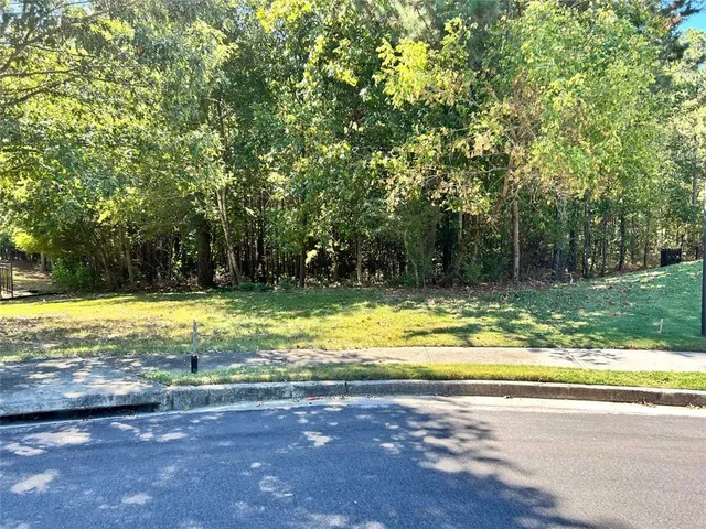 a view of a swimming pool and a yard