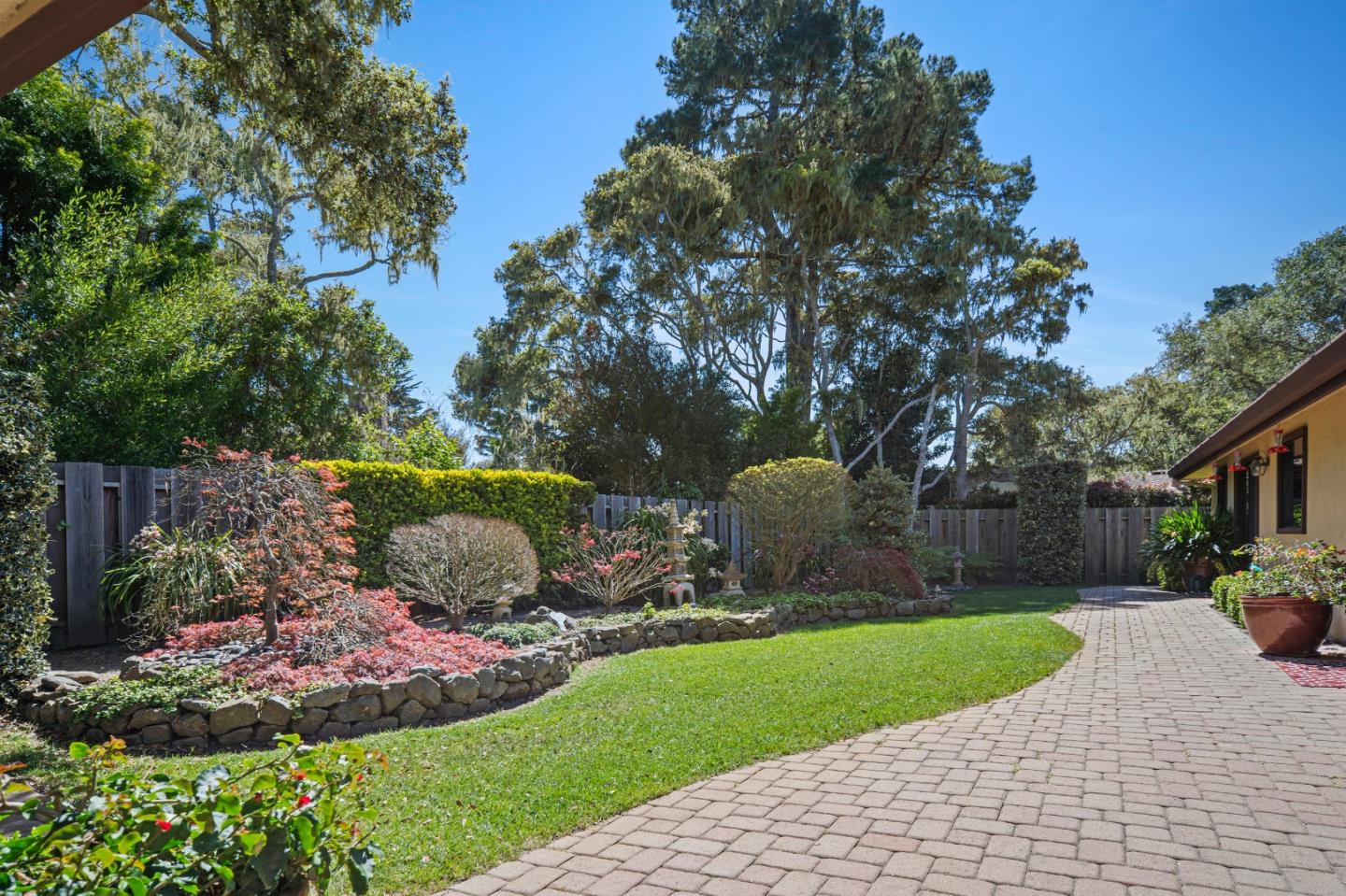 2911 Colton Road Pebble Beach, CA 93953 - Photo 39 of 46 a view of a garden with a fountain