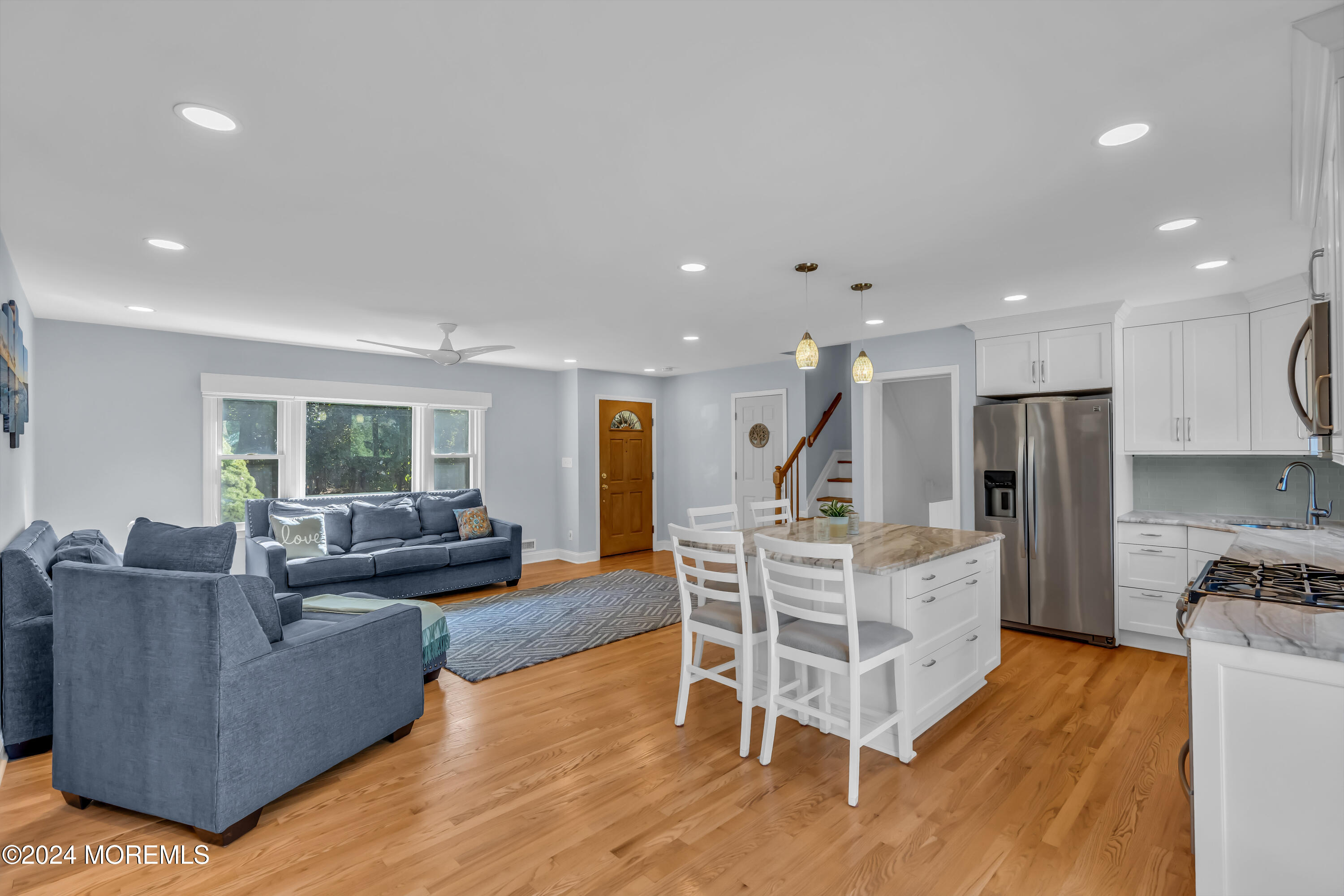 111 Remsen Mill Road Neptune Township, NJ 07753 - Photo 16 of 80 a living room with furniture a wooden floor and a large window