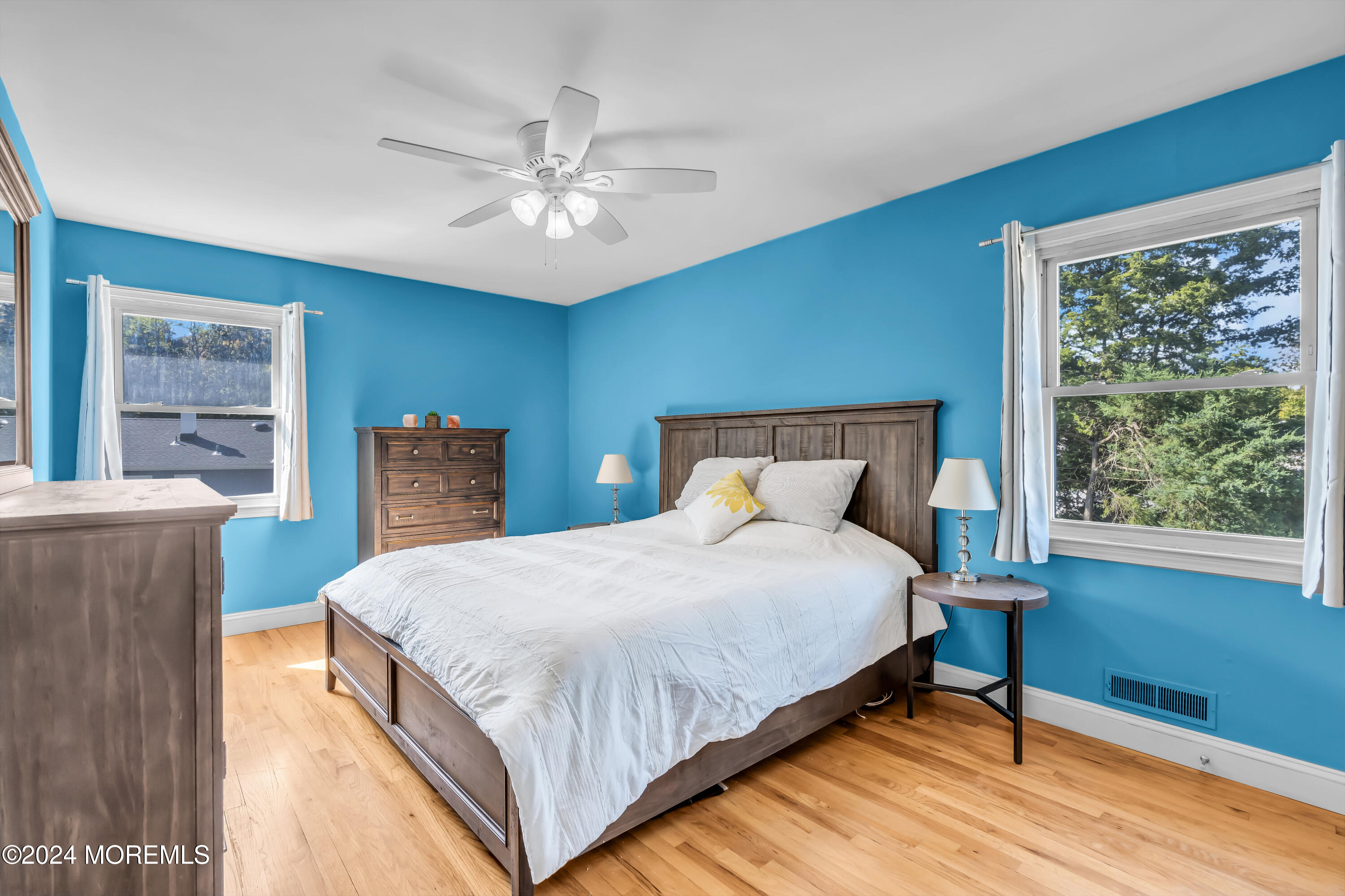 111 Remsen Mill Road Neptune Township, NJ 07753 - Photo 32 of 80 a bedroom with a large bed and a chandelier