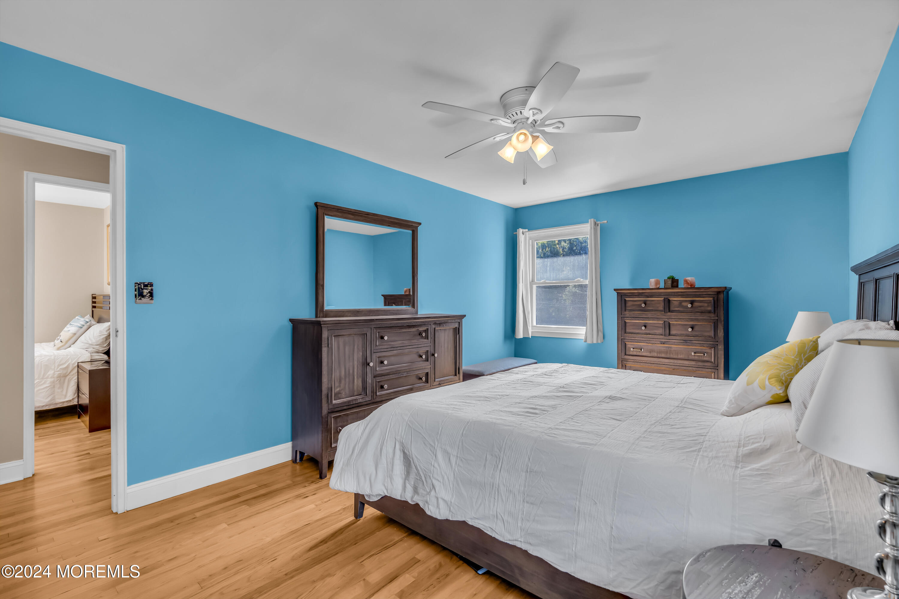 111 Remsen Mill Road Neptune Township, NJ 07753 - Photo 33 of 80 a bedroom with a bed and a chandelier