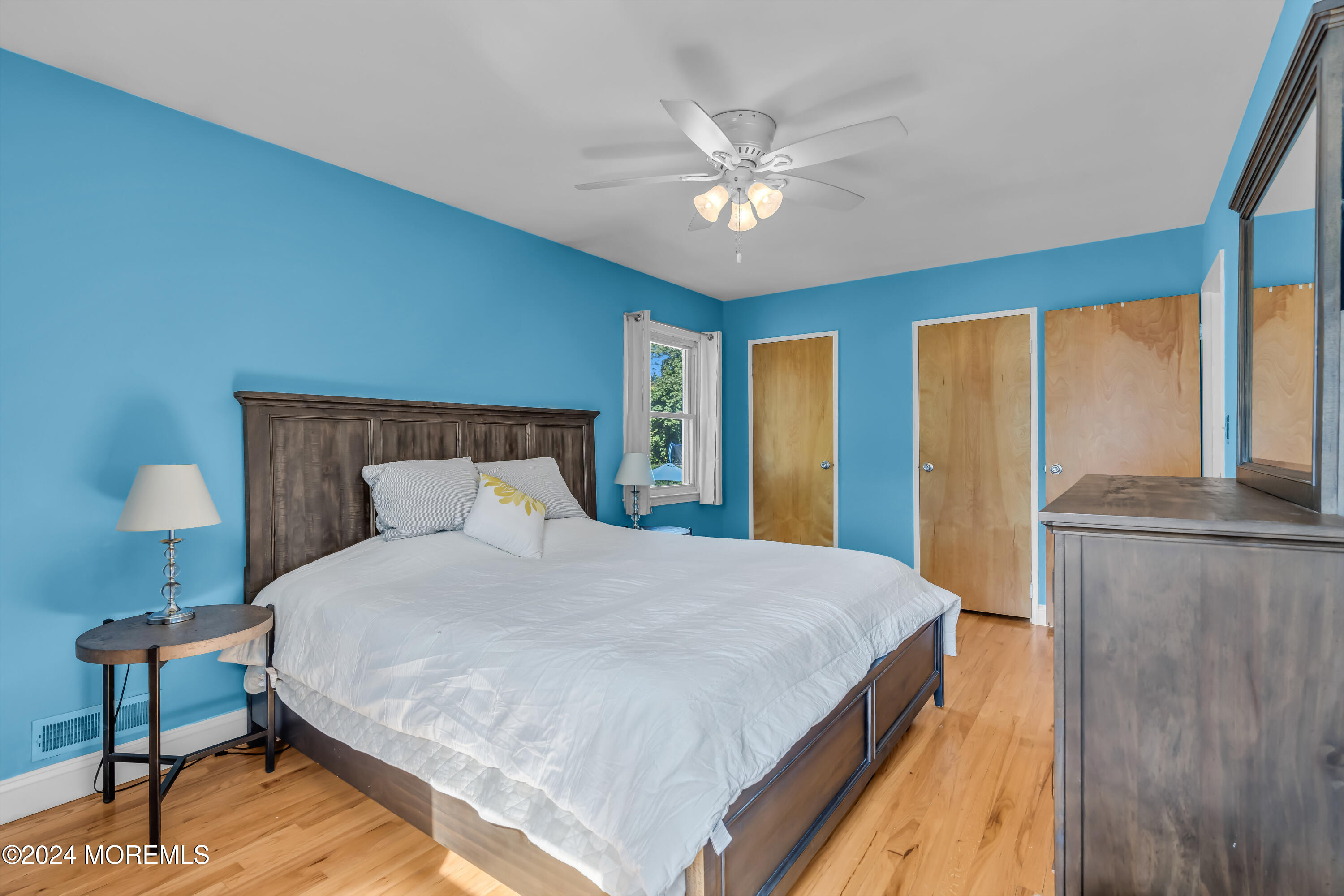 111 Remsen Mill Road Neptune Township, NJ 07753 - Photo 34 of 80 a bedroom with a bed and a chandelier