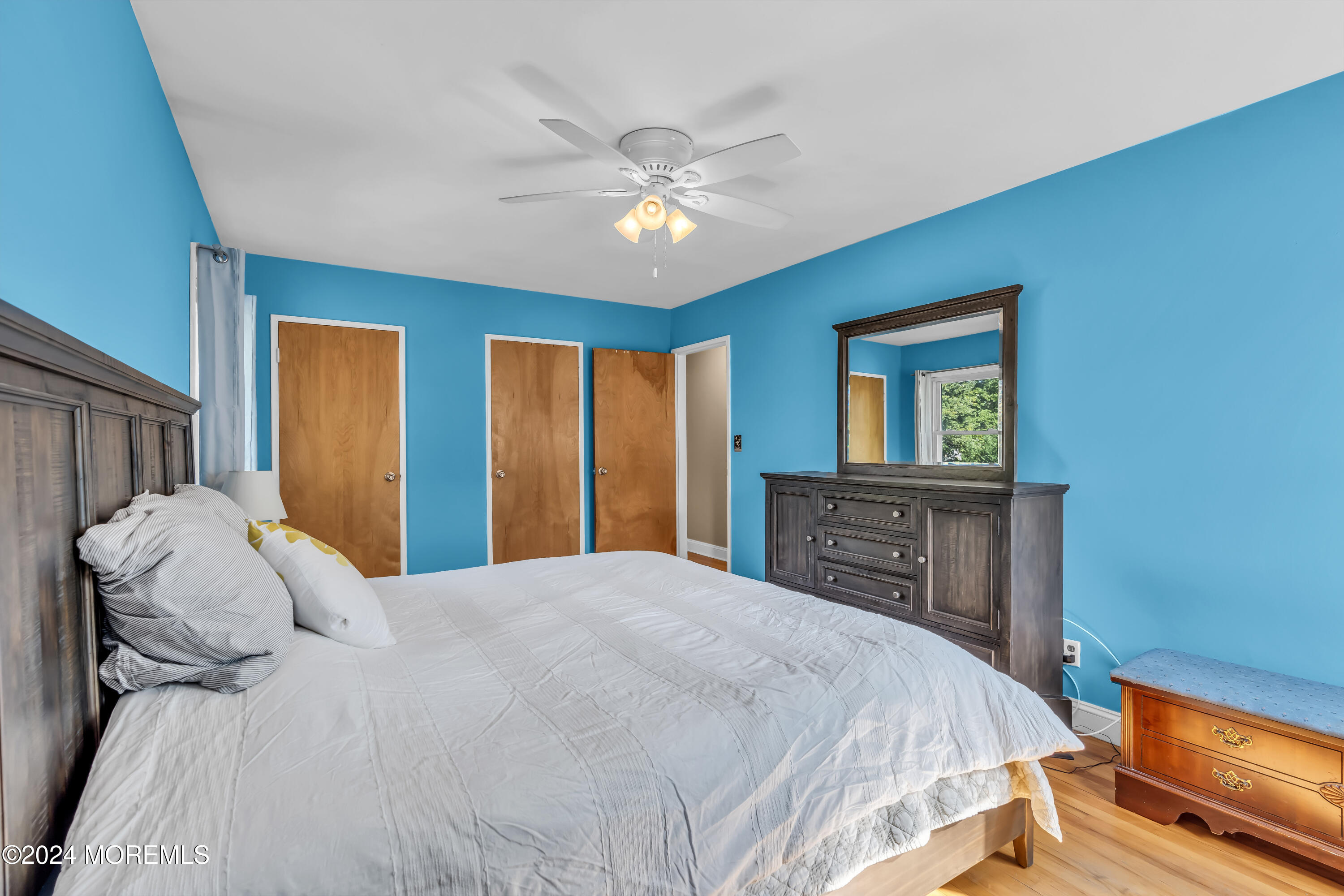111 Remsen Mill Road Neptune Township, NJ 07753 - Photo 35 of 80 a bedroom with a bed and a chandelier