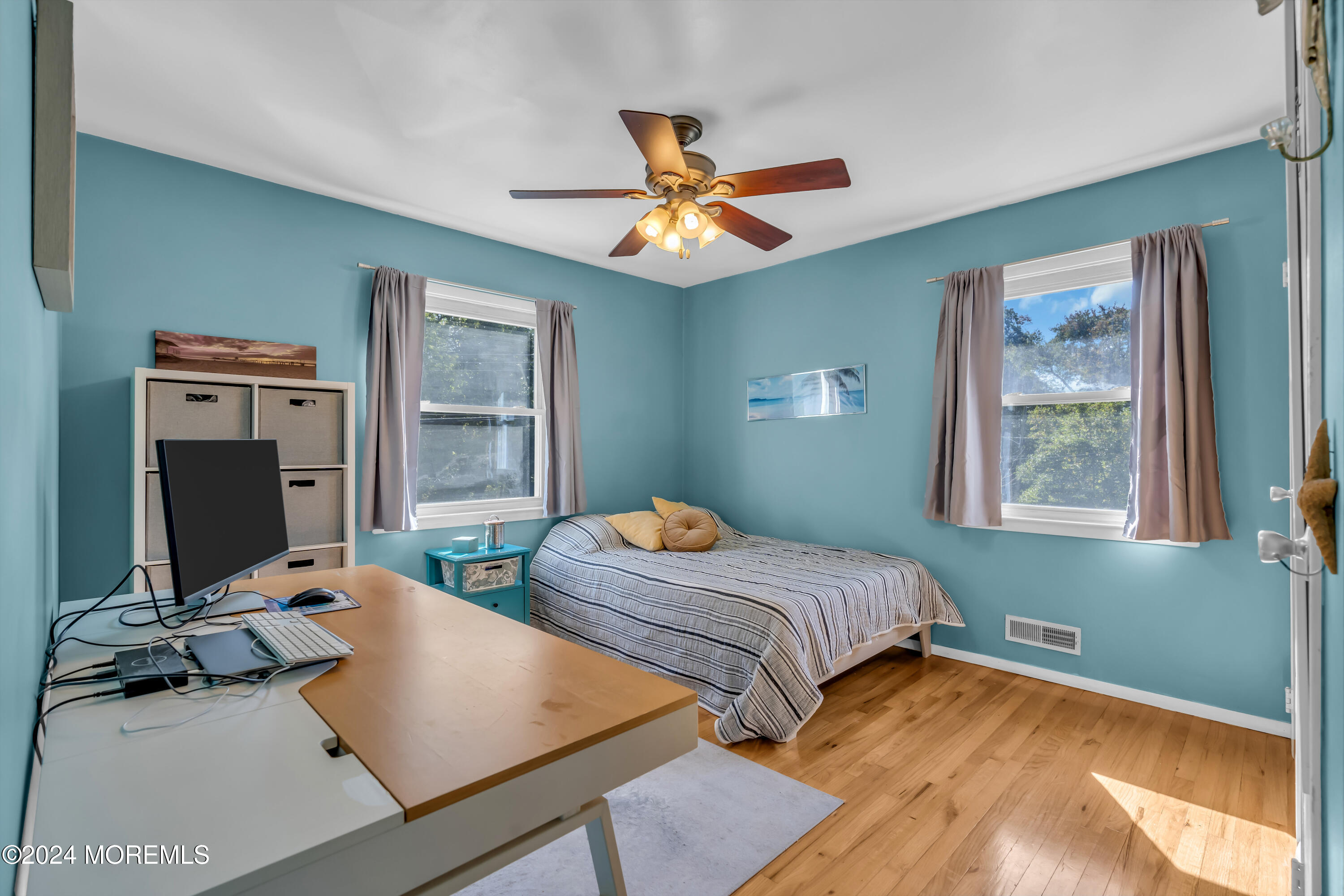 111 Remsen Mill Road Neptune Township, NJ 07753 - Photo 38 of 80 a bedroom with two beds and a chandelier