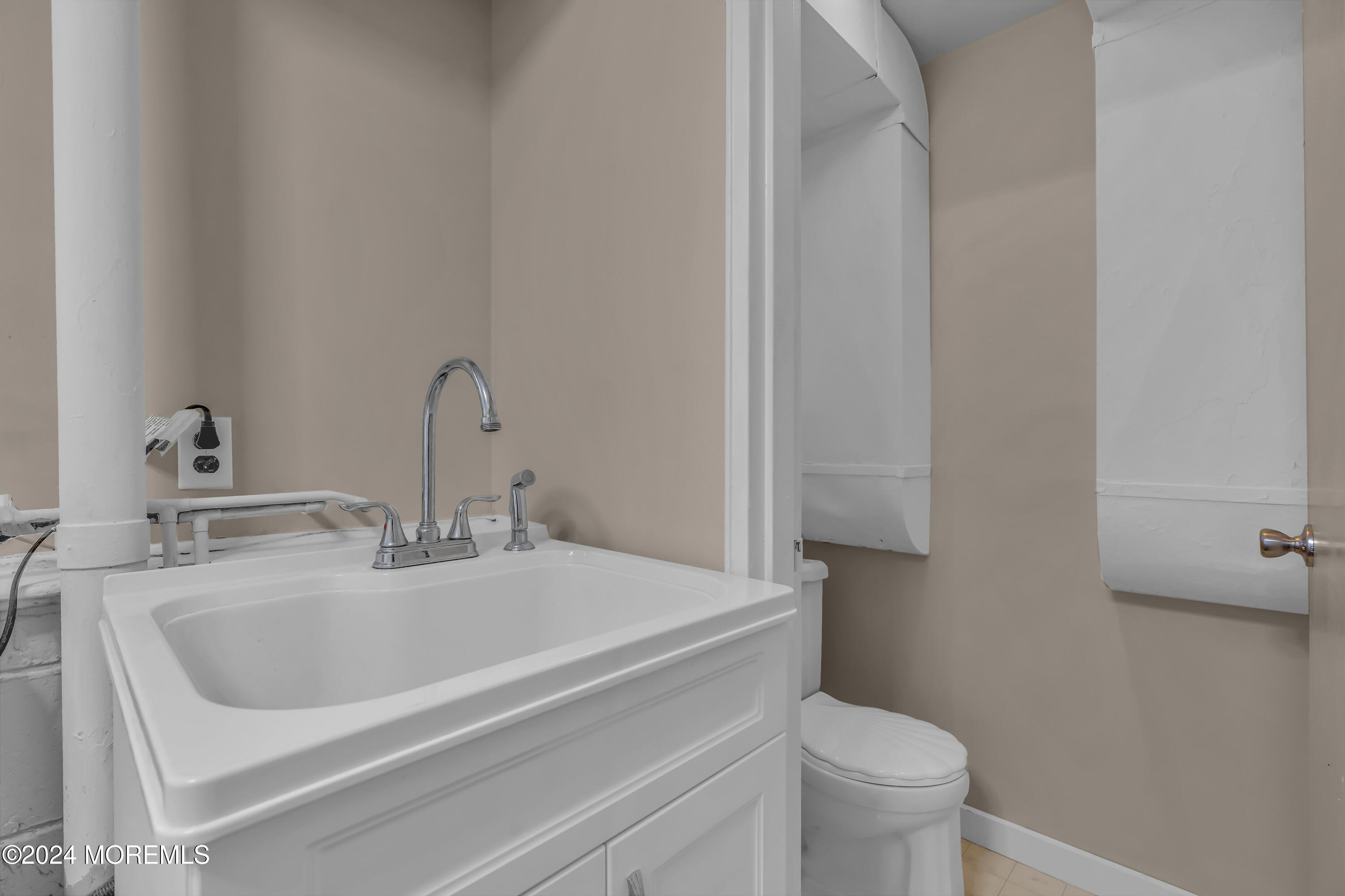 111 Remsen Mill Road Neptune Township, NJ 07753 - Photo 44 of 80 a bathroom with a sink and a toilet