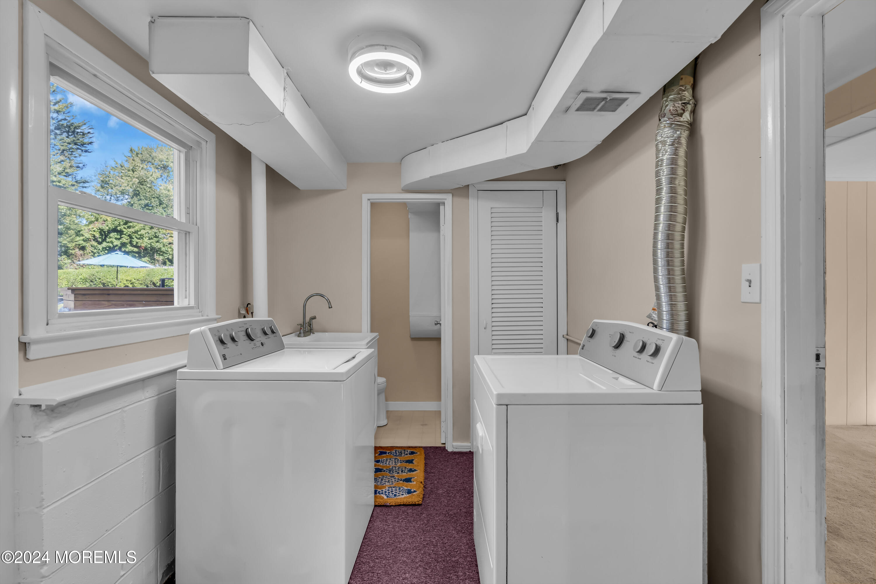 111 Remsen Mill Road Neptune Township, NJ 07753 - Photo 47 of 80 a bathroom with a sink and a mirror