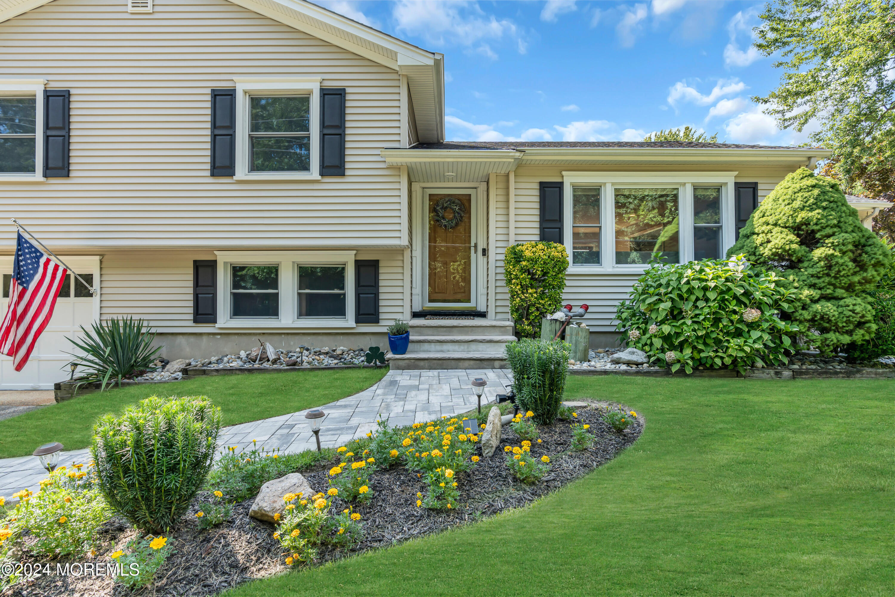 111 Remsen Mill Road Neptune Township, NJ 07753 - Photo 5 of 80 a front view of a house with garden