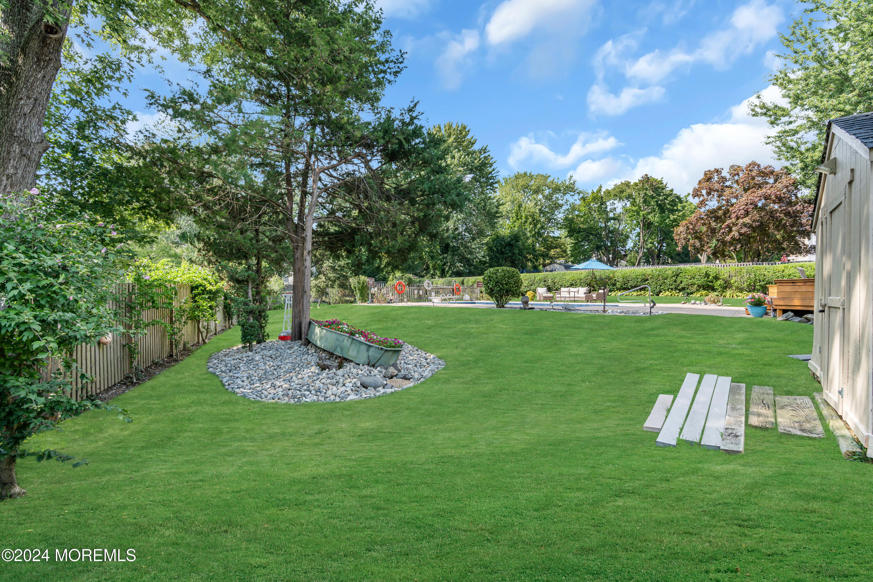 111 Remsen Mill Road Neptune Township, NJ 07753 - Photo 66 of 80 a view of a table and chairs in the garden
