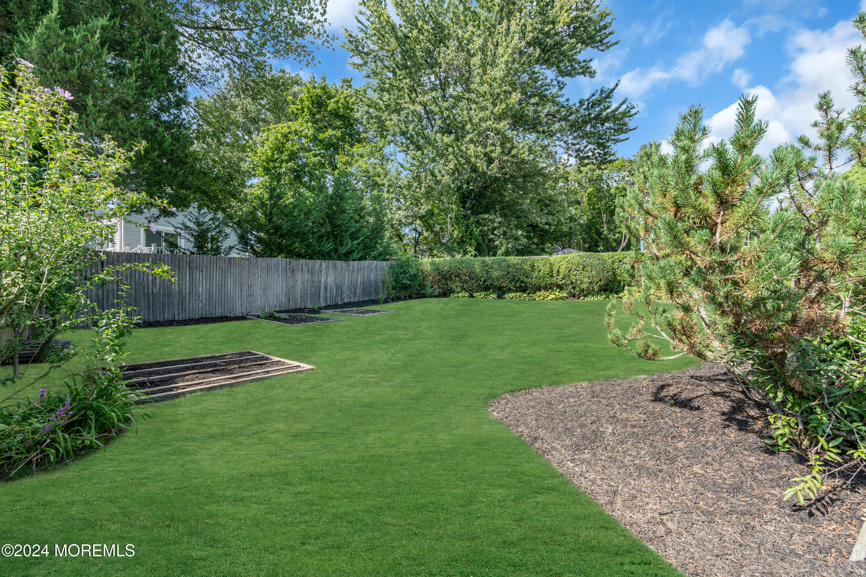 111 Remsen Mill Road Neptune Township, NJ 07753 - Photo 69 of 80 a view of a backyard with a garden