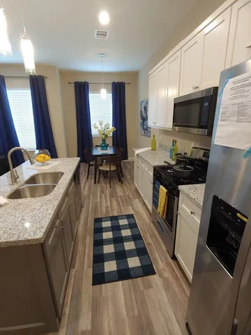 a bedroom with a large bed and a walk in closet