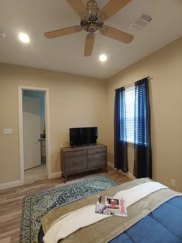 a bathroom with a toilet a sink and shower