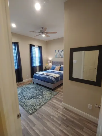 a bathroom with a sink toilet and a mirror